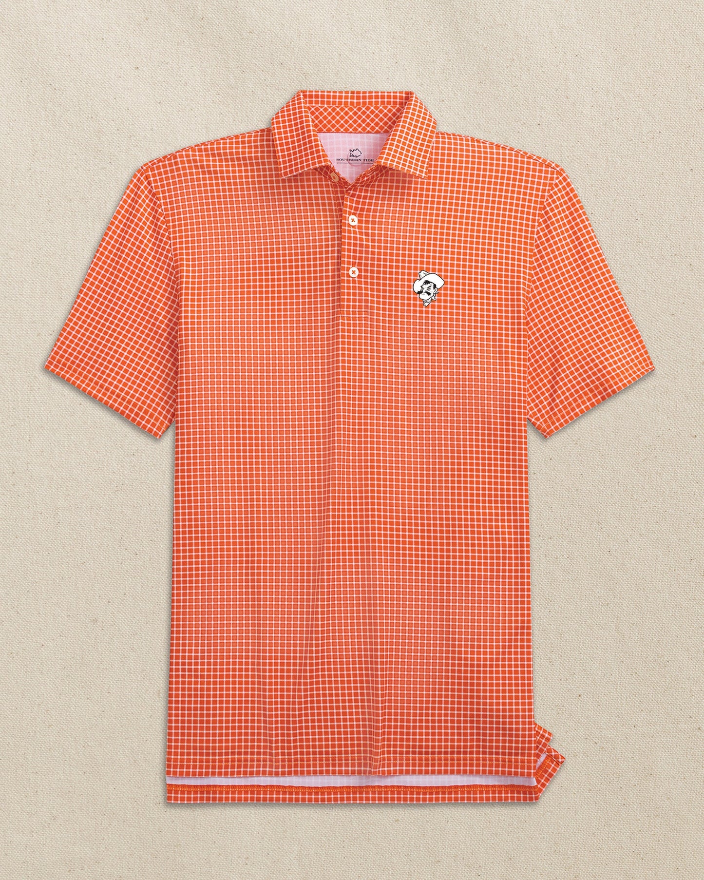 The front view of the Southern Tide Oklahoma State Pistol Pete Driver Dunes Edge Plaid Polo by Southern Tide - Endzone Orange